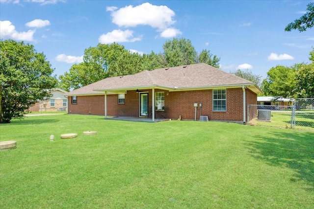 900 Amy Way, Bonham, TX 75418 - back of property with brick siding and a patio area