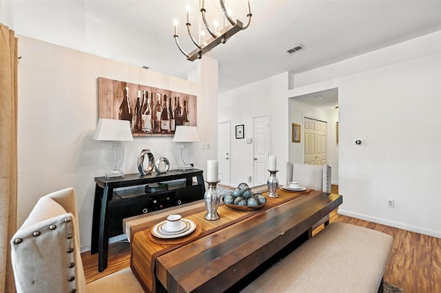 8311 Paxson Trl, Dallas, TX 75249 - dining space with a chandelier and light wood-style flooring