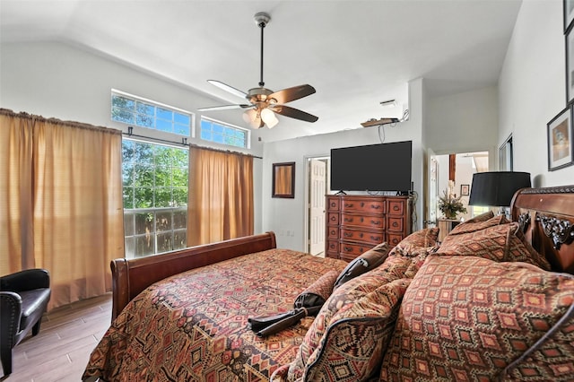 8311 Paxson Trl, Dallas, TX 75249 - bedroom with wood finished floors, lofted ceiling, and a ceiling fan
