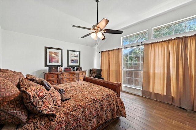8311 Paxson Trl, Dallas, TX 75249 - bedroom featuring multiple windows, wood finished floors, high vaulted ceiling, and ceiling fan