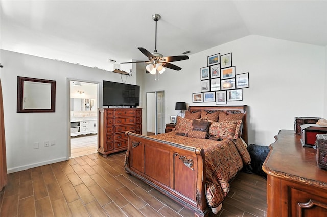 8311 Paxson Trl, Dallas, TX 75249 - bedroom featuring dark wood finished floors, lofted ceiling, ceiling fan, and ensuite bath