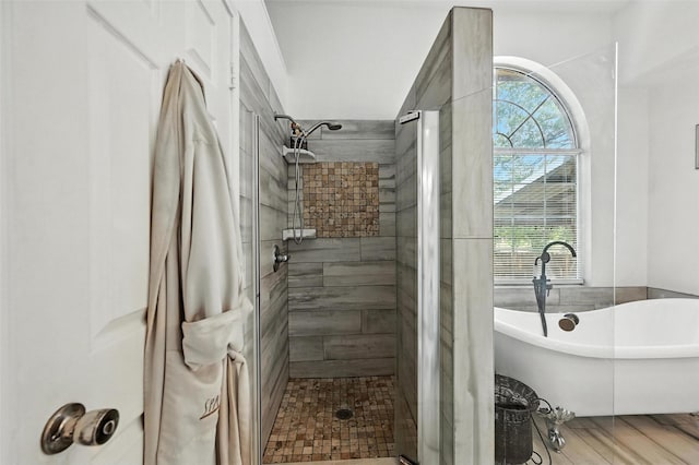 8311 Paxson Trl, Dallas, TX 75249 - full bathroom featuring a shower stall and a freestanding bath