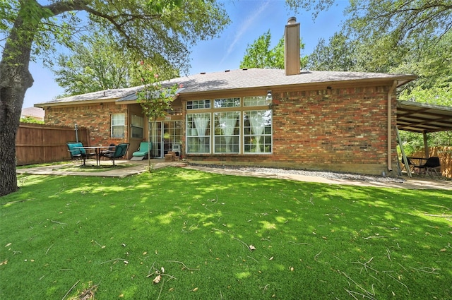 8311 Paxson Trl, Dallas, TX 75249 - rear view of house with brick siding, a patio, and a chimney