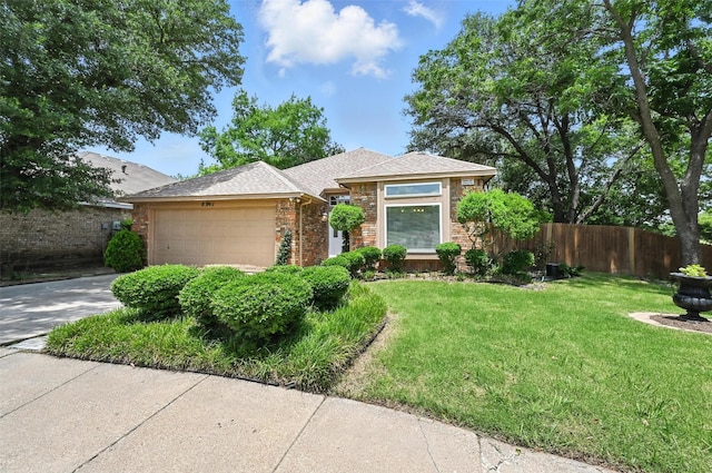 8311 Paxson Trl, Dallas, TX 75249 - view of front of house featuring an attached garage, brick siding, and driveway