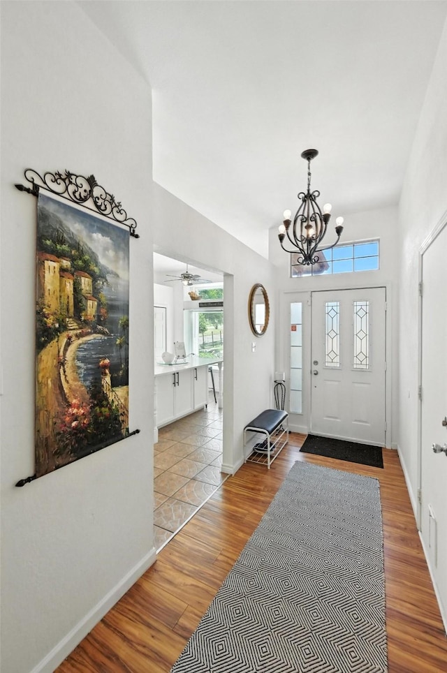 8311 Paxson Trl, Dallas, TX 75249 - foyer featuring wood finished floors, a chandelier, and ceiling fan