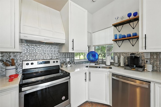 8311 Paxson Trl, Dallas, TX 75249 - kitchen featuring appliances with stainless steel finishes, white cabinetry, decorative backsplash, and light countertops