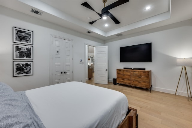 11405 Antler Ridge Way, Argyle, TX 76226 - bedroom featuring a tray ceiling, light wood-style floors, recessed lighting, and ceiling fan