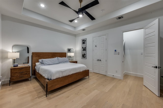11405 Antler Ridge Way, Argyle, TX 76226 - bedroom featuring a raised ceiling, light wood-style floors, recessed lighting, and a ceiling fan
