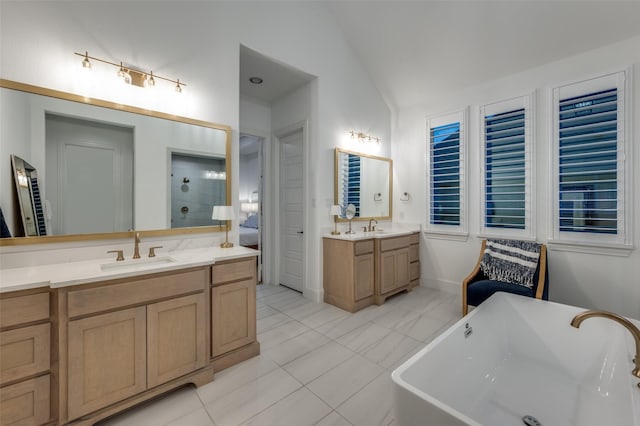 11405 Antler Ridge Way, Argyle, TX 76226 - full bath featuring vaulted ceiling, two vanities, a soaking tub, tile patterned flooring, and a shower