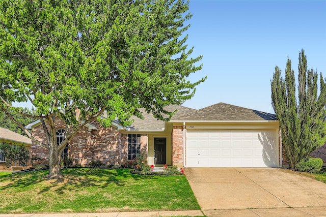 7921 Mourning Dove Dr, Arlington, TX 76002 - view of front of property with a garage, concrete driveway, a front lawn, brick siding, and roof with shingles