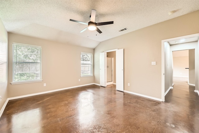 7921 Mourning Dove Dr, Arlington, TX 76002 - unfurnished bedroom with finished concrete flooring, a textured ceiling, lofted ceiling, and ceiling fan
