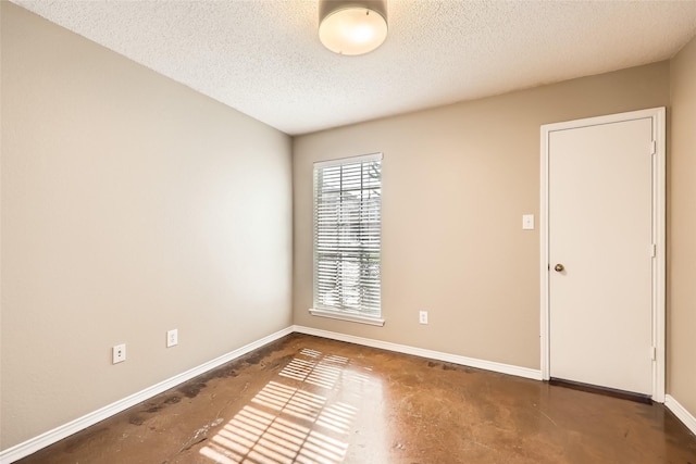 7921 Mourning Dove Dr, Arlington, TX 76002 - spare room featuring finished concrete floors and a textured ceiling