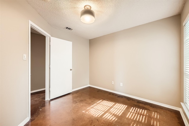 7921 Mourning Dove Dr, Arlington, TX 76002 - unfurnished room with finished concrete floors and a textured ceiling