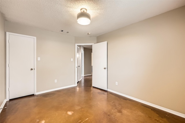 7921 Mourning Dove Dr, Arlington, TX 76002 - unfurnished room featuring concrete flooring and a textured ceiling