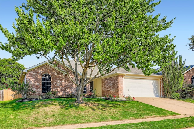 7921 Mourning Dove Dr, Arlington, TX 76002 - view of front facade with an attached garage, brick siding, and driveway