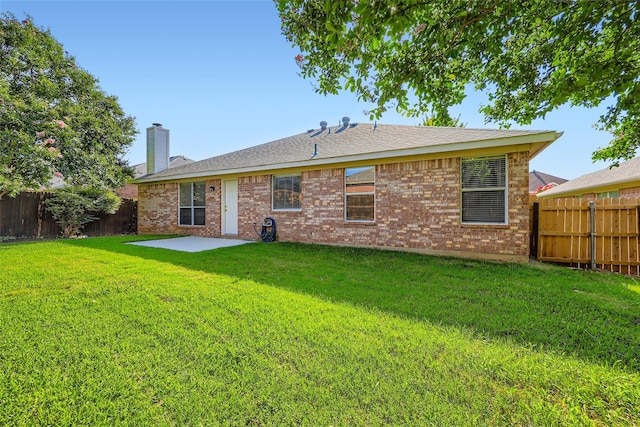 7921 Mourning Dove Dr, Arlington, TX 76002 - back of house featuring a fenced backyard, a patio, a chimney, and brick siding