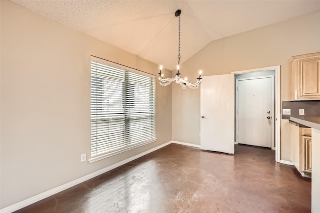 7921 Mourning Dove Dr, Arlington, TX 76002 - unfurnished dining area with finished concrete floors, a chandelier, and vaulted ceiling