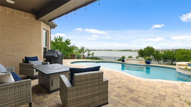 2809 Burgundy Trl, Rowlett, TX 75088 - view of swimming pool with a patio area, a grill, a water view, and an outdoor hangout area