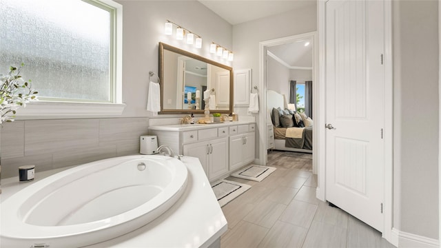 2809 Burgundy Trl, Rowlett, TX 75088 - bathroom with vanity, a garden tub, and ensuite bathroom