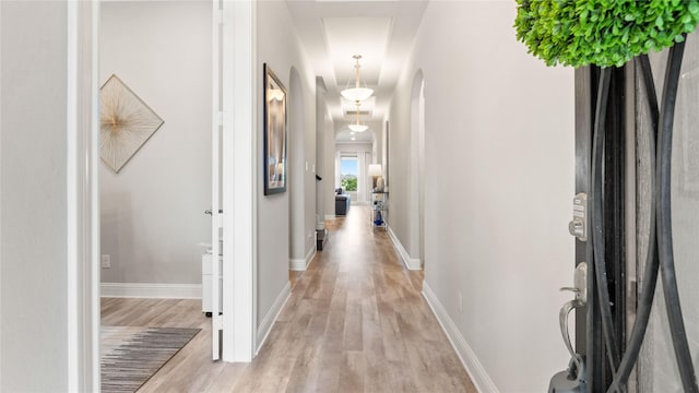 2809 Burgundy Trl, Rowlett, TX 75088 - hall with arched walkways and light wood finished floors