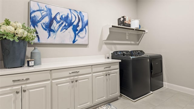 2809 Burgundy Trl, Rowlett, TX 75088 - washroom featuring washer and dryer, cabinet space, and light tile patterned floors