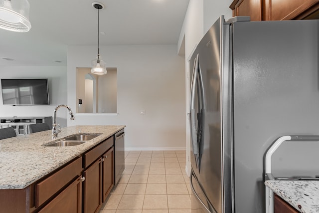 11401 Gale Ridge Ter, Fort Worth, TX 76052 - kitchen with appliances with stainless steel finishes, hanging light fixtures, light stone countertops, and light tile patterned flooring