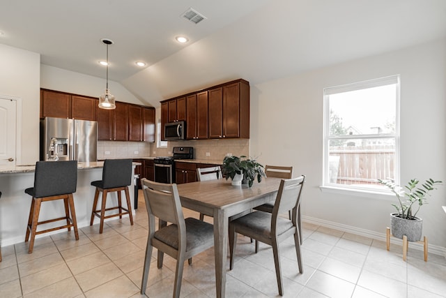 11401 Gale Ridge Ter, Fort Worth, TX 76052 - dining area featuring lofted ceiling and light tile patterned flooring