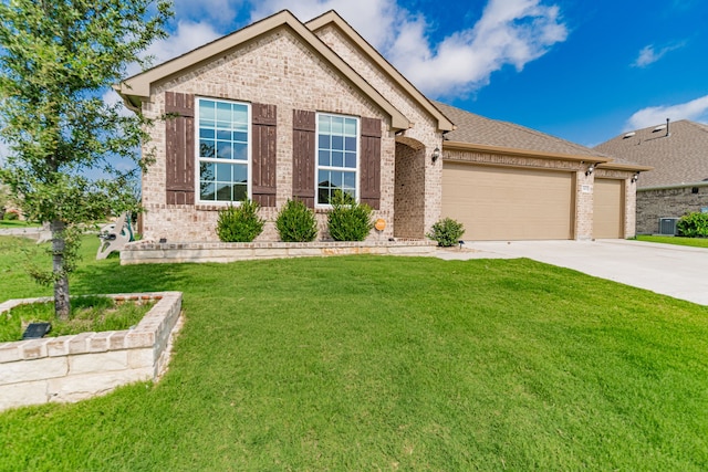 11401 Gale Ridge Ter, Fort Worth, TX 76052 - view of front facade with brick siding, an attached garage, driveway, and a front yard