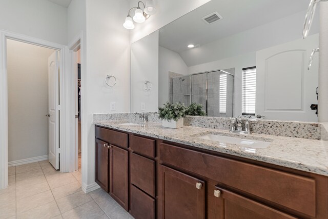 11401 Gale Ridge Ter, Fort Worth, TX 76052 - full bathroom featuring double vanity, a shower stall, vaulted ceiling, and tile patterned flooring