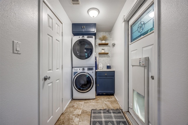191 Black Forest Dr, Pottsboro, TX 75076 - laundry room with stacked washing machine and dryer and cabinet space