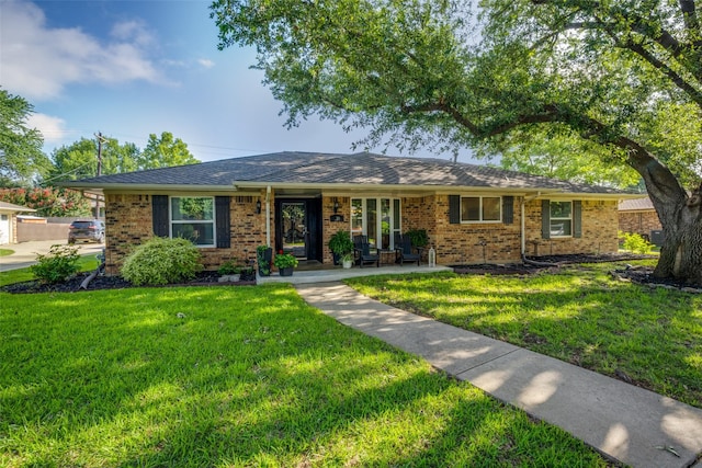 710 Northridge St, Denton, TX 76201 - ranch-style home featuring a front yard and brick siding