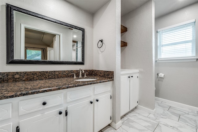 710 Northridge St, Denton, TX 76201 - bathroom featuring vanity and marble finish flooring