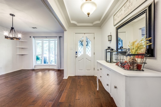 710 Northridge St, Denton, TX 76201 - foyer with a chandelier, dark wood finished floors, and ornamental molding