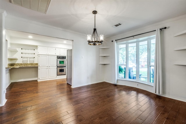 710 Northridge St, Denton, TX 76201 - unfurnished dining area with a chandelier, dark wood-style flooring, crown molding, and built in features