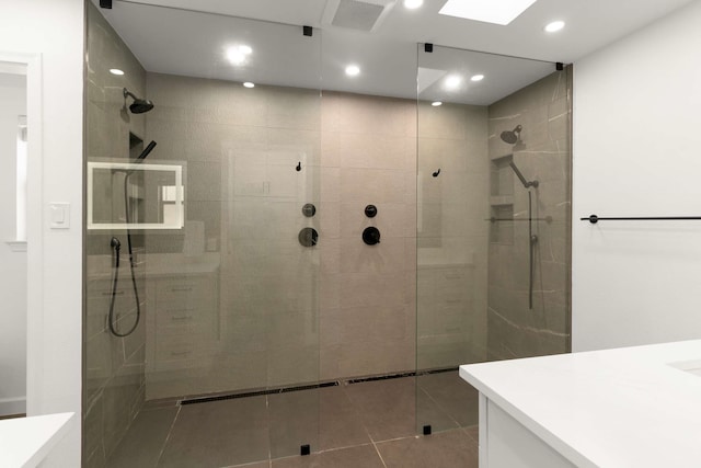 6207 Crested Butte Dr, Dallas, TX 75252 - bathroom featuring vanity, a walk in shower, recessed lighting, and tile patterned flooring
