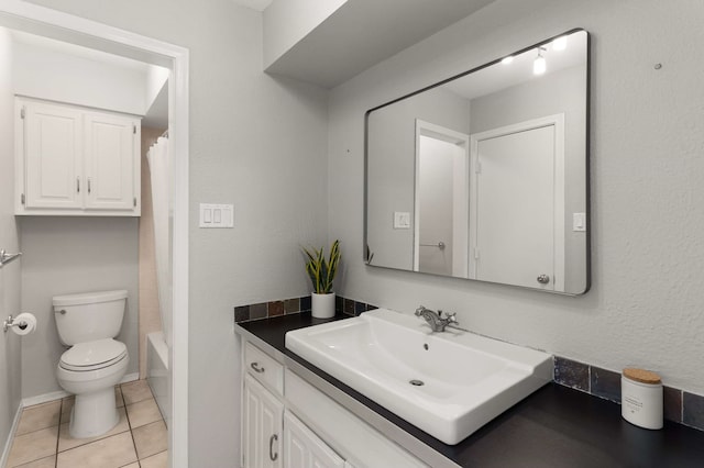6207 Crested Butte Dr, Dallas, TX 75252 - bathroom featuring vanity, tile patterned floors, and shower / tub combo with curtain