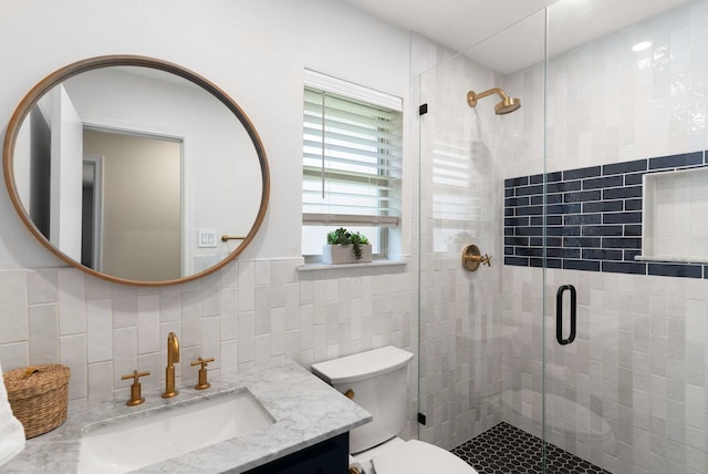 6207 Crested Butte Dr, Dallas, TX 75252 - bathroom with tile walls, a shower stall, and vanity