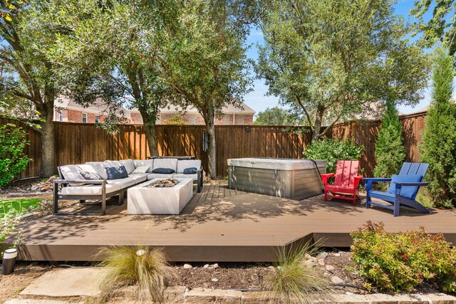 6207 Crested Butte Dr, Dallas, TX 75252 - wooden terrace with a hot tub, a fenced backyard, and an outdoor living space with a fire pit