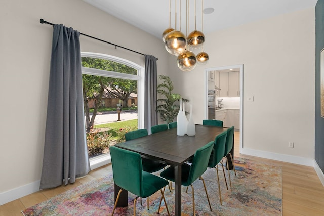 6207 Crested Butte Dr, Dallas, TX 75252 - dining area featuring a chandelier and light wood-style floors