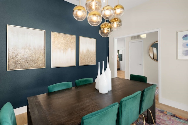 6207 Crested Butte Dr, Dallas, TX 75252 - dining space with a chandelier and wood finished floors
