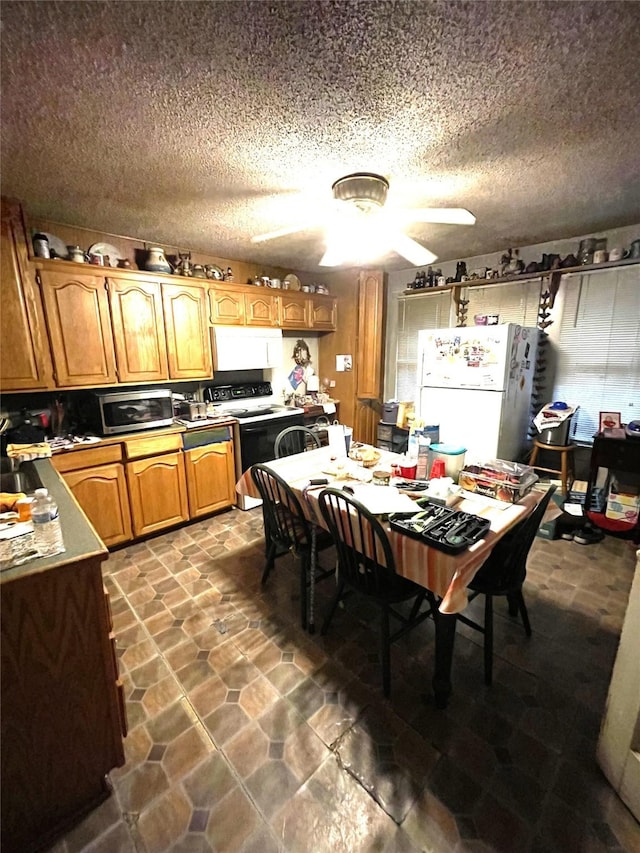 408 N Woods St, Sherman, TX 75092 - dining room with a textured ceiling and a ceiling fan