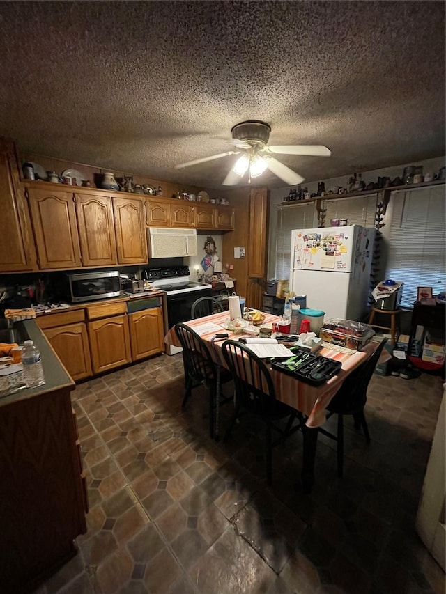 408 N Woods St, Sherman, TX 75092 - dining area featuring a ceiling fan and a textured ceiling