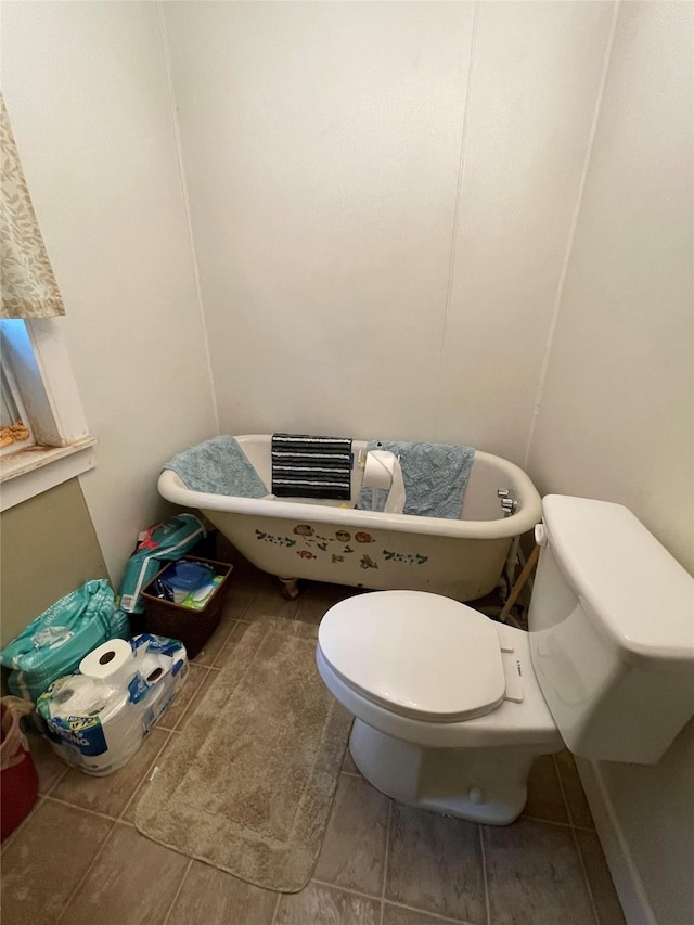 408 N Woods St, Sherman, TX 75092 - bathroom with toilet and tile patterned floors