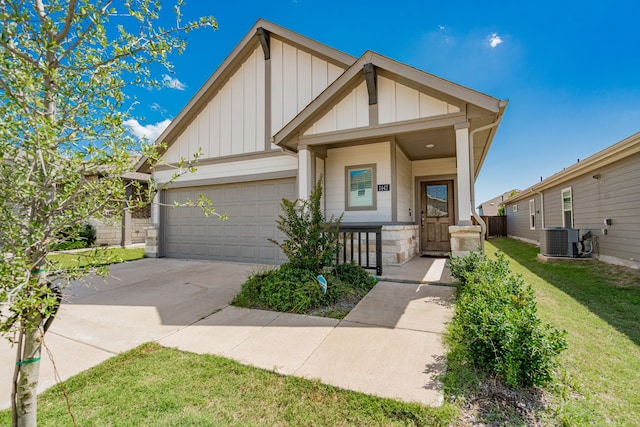 1447 Rolling Fox Dr, Forney, TX 75126 - view of front of house featuring board and batten siding, driveway, an attached garage, a front lawn, and a porch
