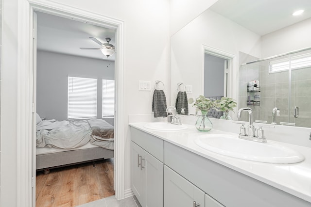 1447 Rolling Fox Dr, Forney, TX 75126 - bathroom featuring double vanity, ensuite bathroom, a ceiling fan, and a tile shower