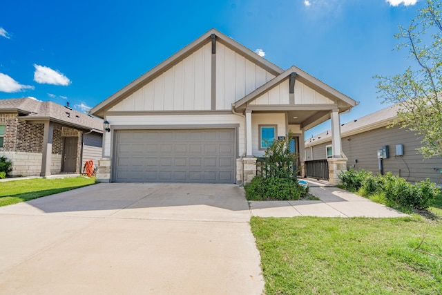 1447 Rolling Fox Dr, Forney, TX 75126 - view of front of property with board and batten siding, a garage, driveway, and a front yard