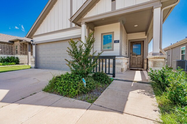 1447 Rolling Fox Dr, Forney, TX 75126 - view of front facade with board and batten siding, driveway, and a garage