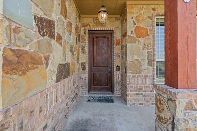 111 Meadow Bridge Dr, Weatherford, TX 76085 - view of exterior entry with stone siding and a porch