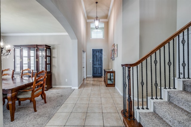 5914 Brookhill Ln, Frisco, TX 75034 - foyer entrance featuring arched walkways, plenty of natural light, stairway, a towering ceiling, and ornamental molding