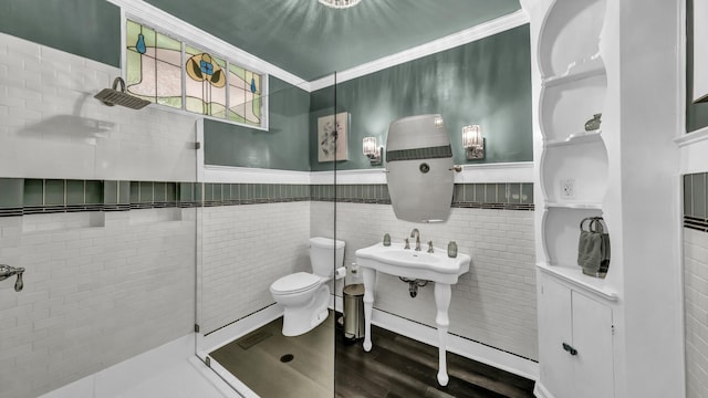 305 E Lee Ave, Weatherford, TX 76086 - bathroom with tiled shower, wood finished floors, and ornamental molding